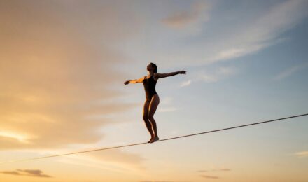 Person reviewing debt to income ratio calculations on paper with a calculator nearby