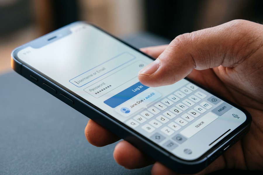 Side-by-side comparison of 1Password and Bitwarden mobile app interfaces on iPhone