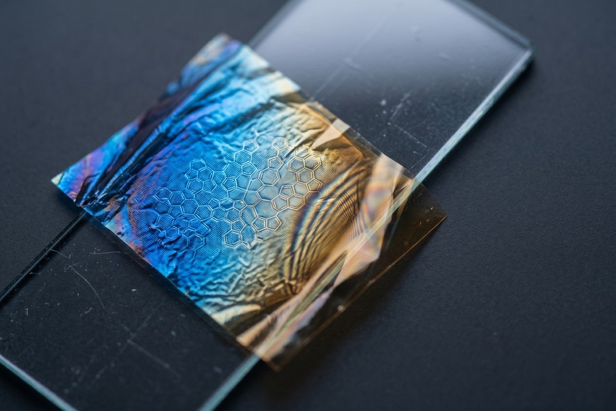 Cross-section diagram of a biodegradable circuit board showing cellulose substrate layers and organic semiconductor traces