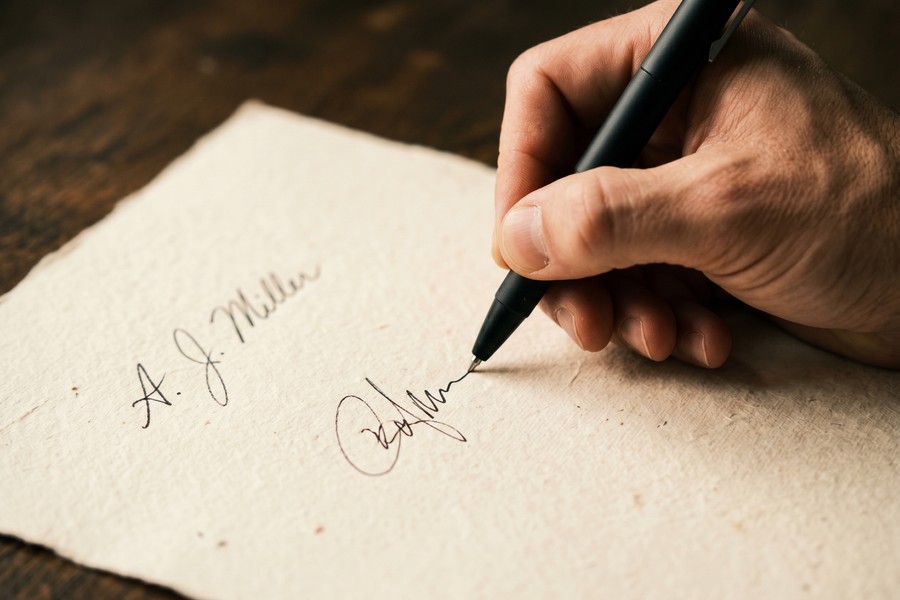 A smartphone screen showing the DocuSign app signature setup interface with drawing and font options